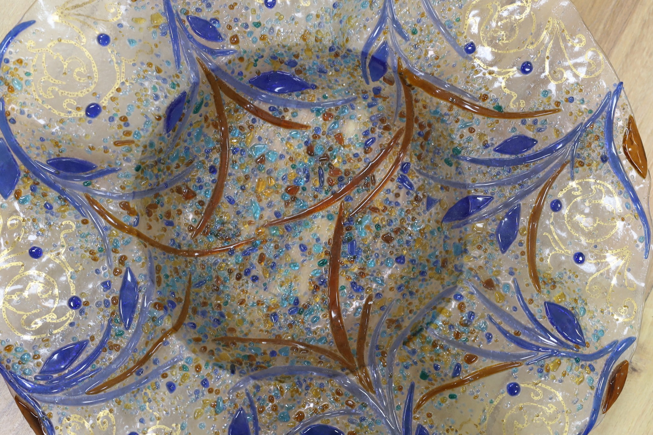 A circular decorative art glass dish, 48cms wide